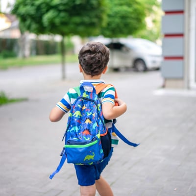 child with backpack