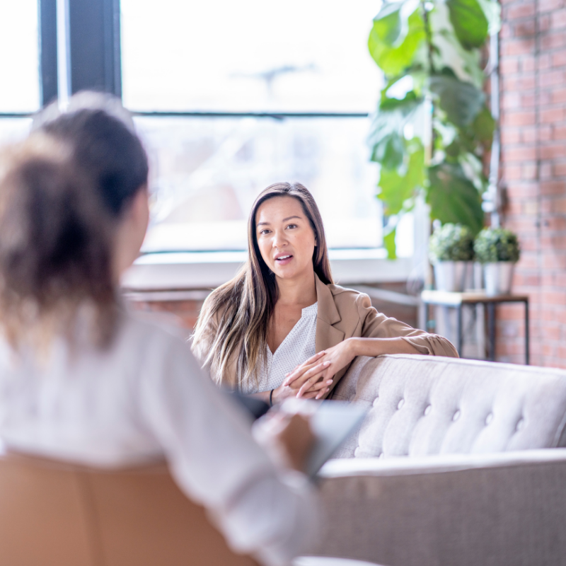 Woman talking therapy in-person